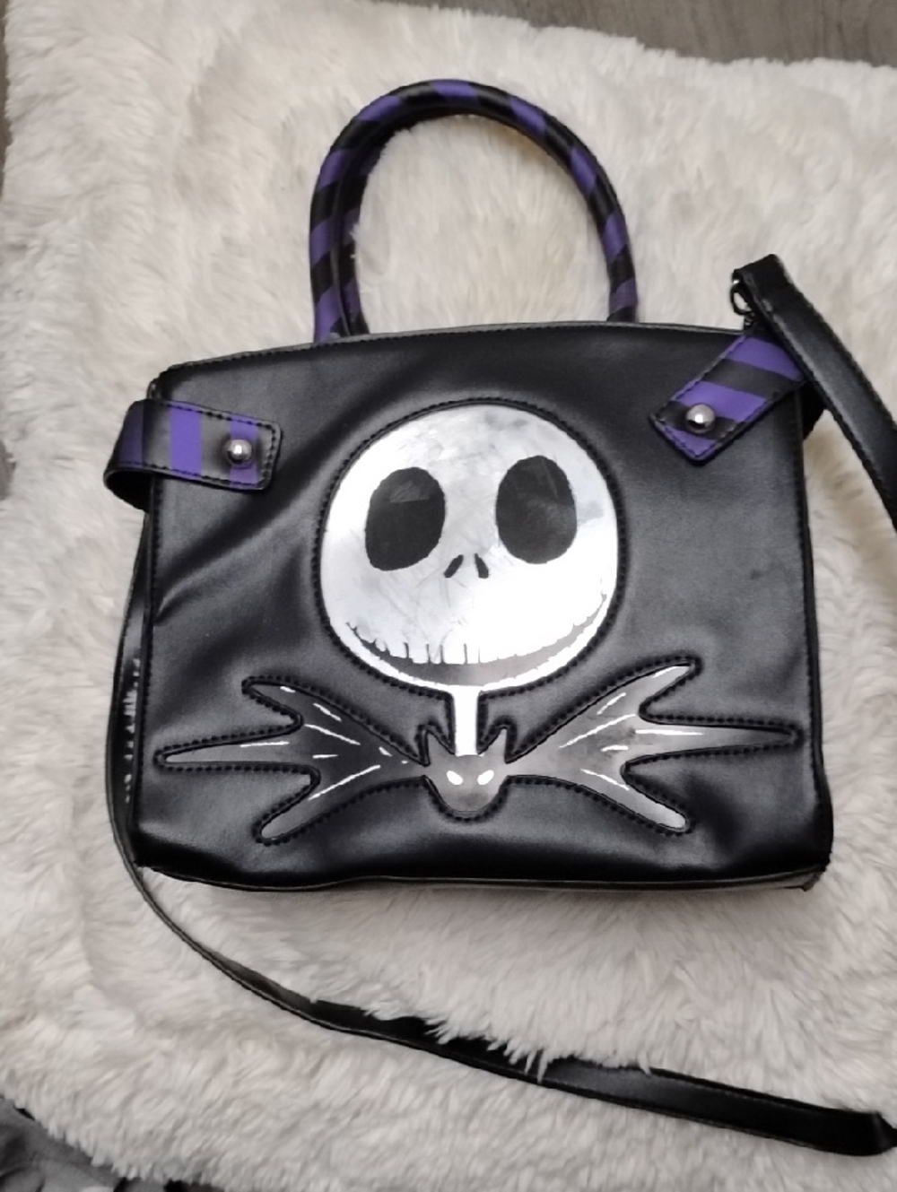 Black Satchel with Purple-Striped Handles and Silver Skull Accent